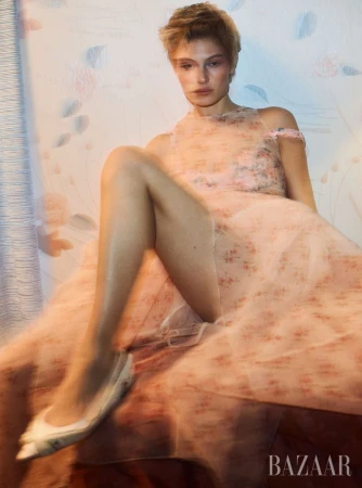 Model Bibi Breslin wearing a pink floral tulle dress in an editorial for Harper's Bazaar U.S. photographed by Josh Olins