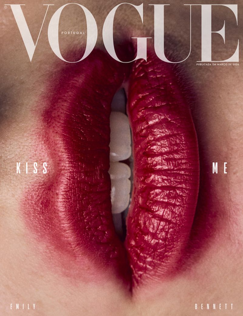 Vogue Portugal cover featuring a close-up of lips painted red, with a small opening showing white teeth, emphasizing beauty and fashion.