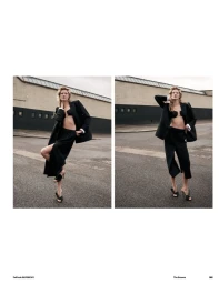 Model standing outdoors wearing a black jacket and long skirt for the Sweet Dream project by Muse Magazine.