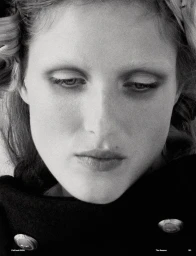Close-up portrait of a woman with styled hair and dark coat for Muse Magazine Sweet Dream project