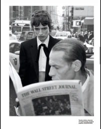 Monochrome fashion editorial featuring two models in a busy New York City street setting by Anthony Arquier for Numéro France.