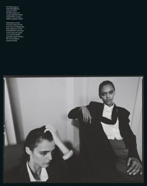Monochrome fashion editorial image of two models posing indoors for Harper's Bazaar Italia