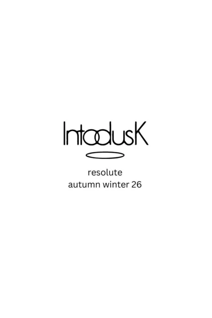 Minimalist text design with the brand name 'Intodusk' above 'resolute' and 'autumn winter 26' on a white backdrop.