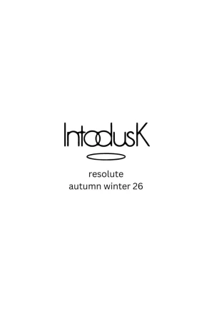 Minimalist text design with the brand name 'Intodusk' above 'resolute' and 'autumn winter 26' on a white backdrop.
