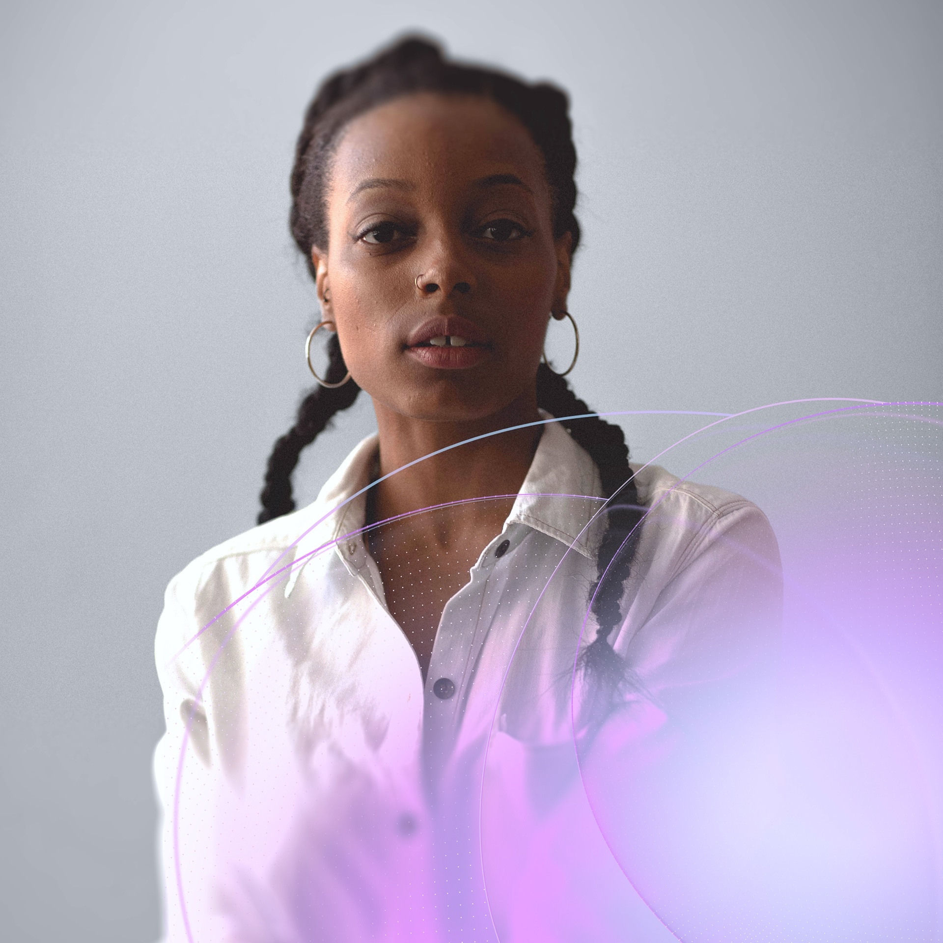 Portrait of a woman with braided hair wearing a white button-down shirt against a gray background with abstract purple graphic elements.