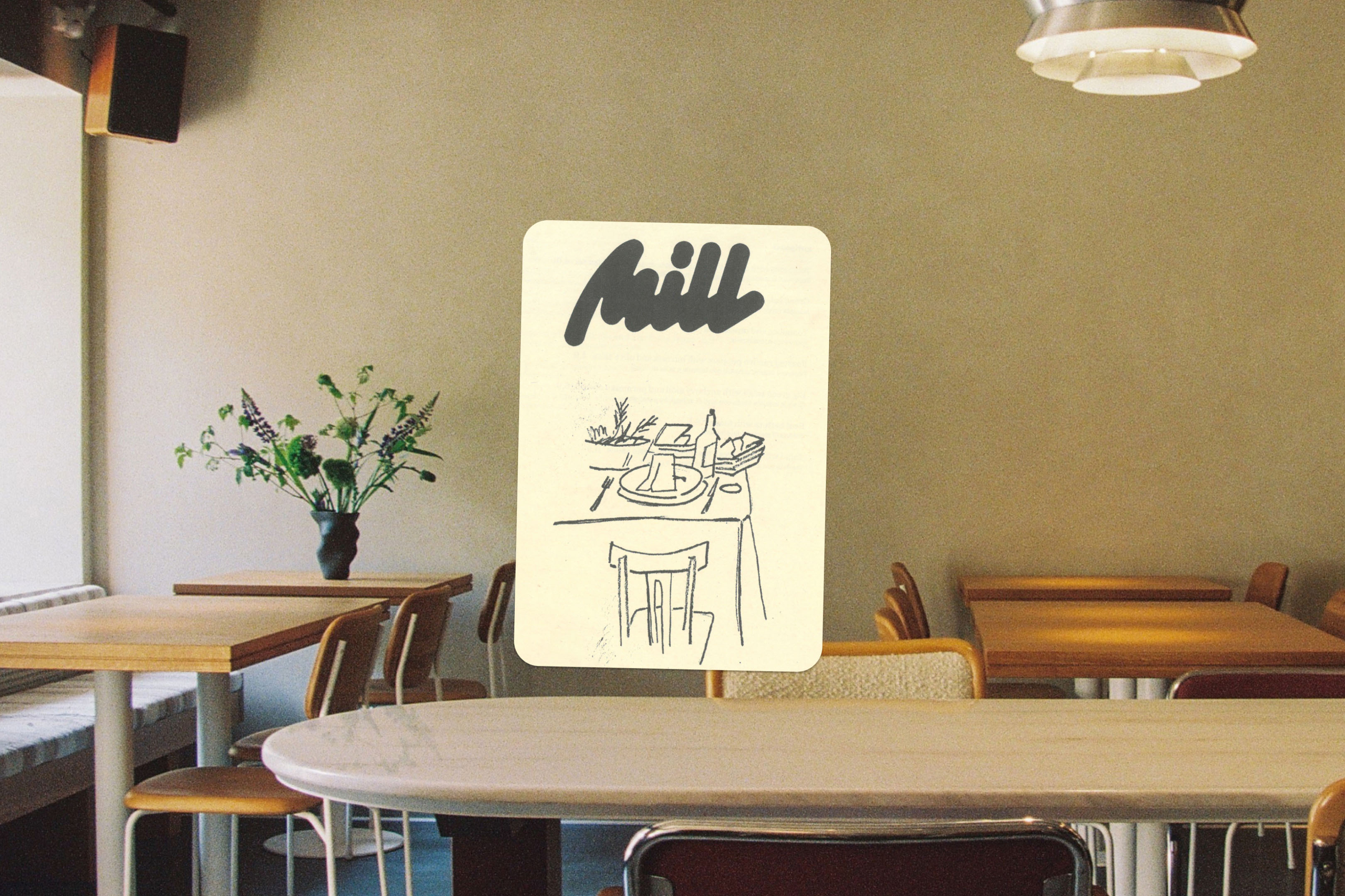 Illustration of a dining table setting on a menu card in a cafe, with wooden chairs and tables visible in the background.
