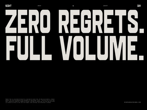 Bold, typographic ad for a beverage called Night & Day, featuring large white text on a black background, promoting 'Zero Regrets. Full Volume.'