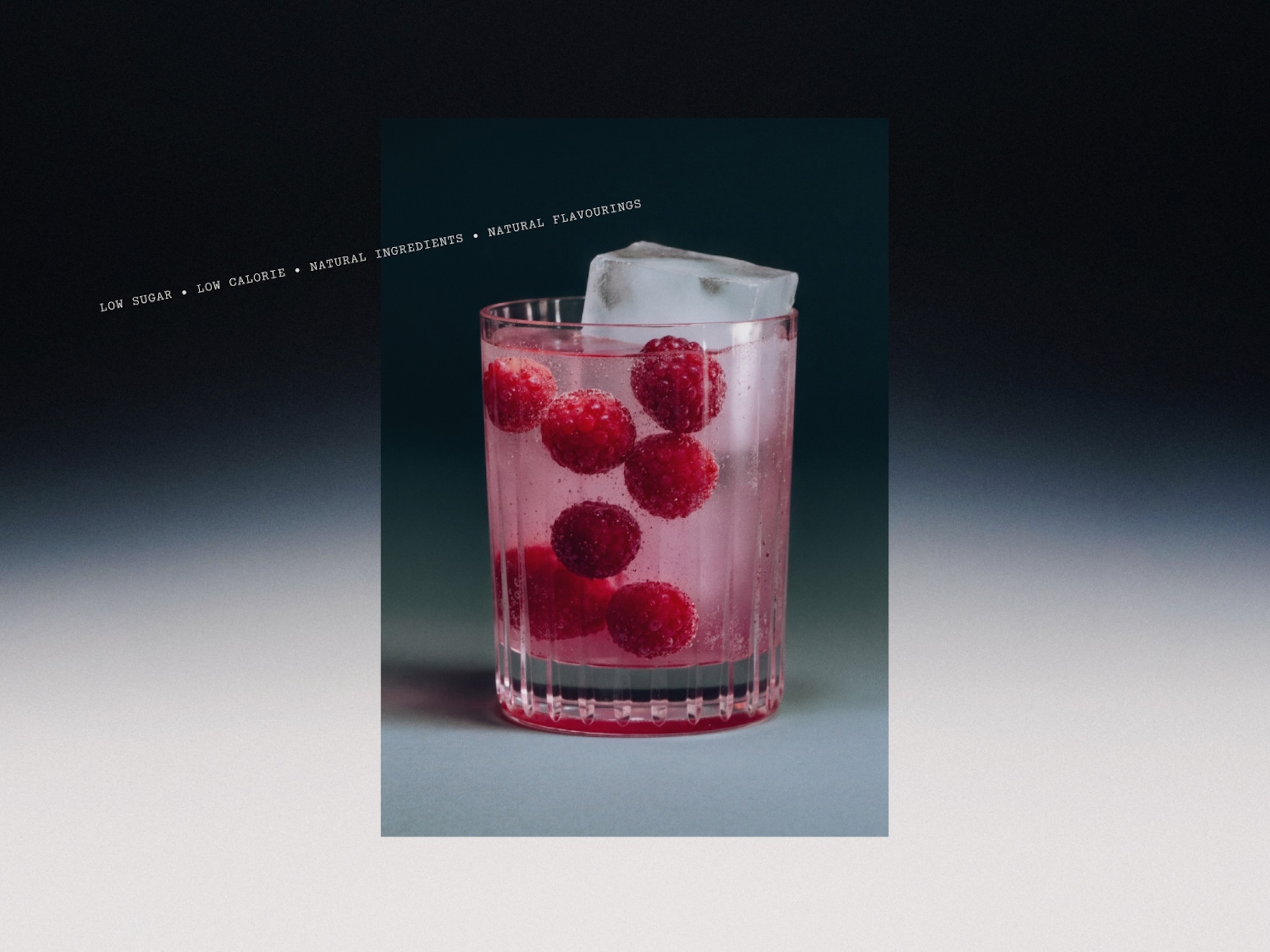 A refreshing drink features a glass filled with a pink liquid, ice cubes, and several bright red raspberries, set against a gradient backdrop.