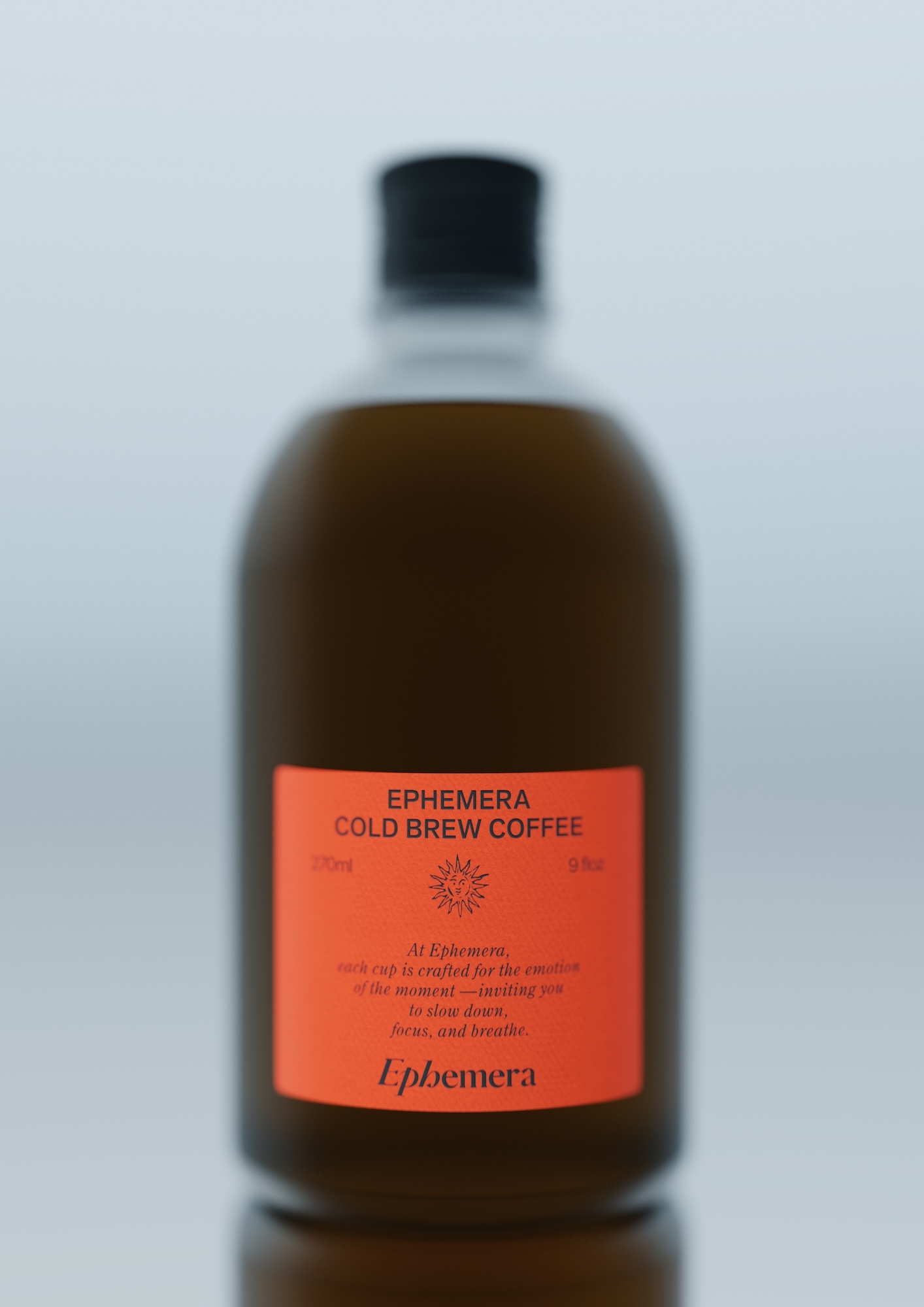 A bottle of Ephemera Cold Brew Coffee features a minimalist orange label with a sun icon, set against a soft, muted background.