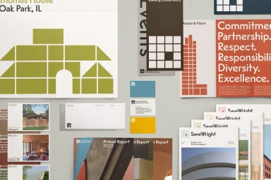 Flat lay of brand identity materials for Frank Lloyd Wright Building Conservancy featuring brochures, business cards, and printed reports.