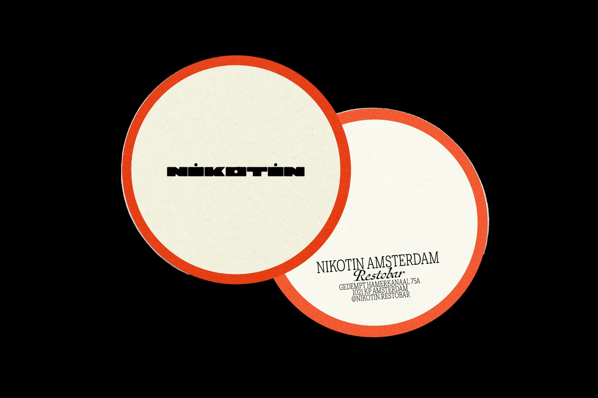 Two cream-colored round coasters with a red border feature the brand name "Nikotin Amsterdam Restobar" in black text on a dark background.