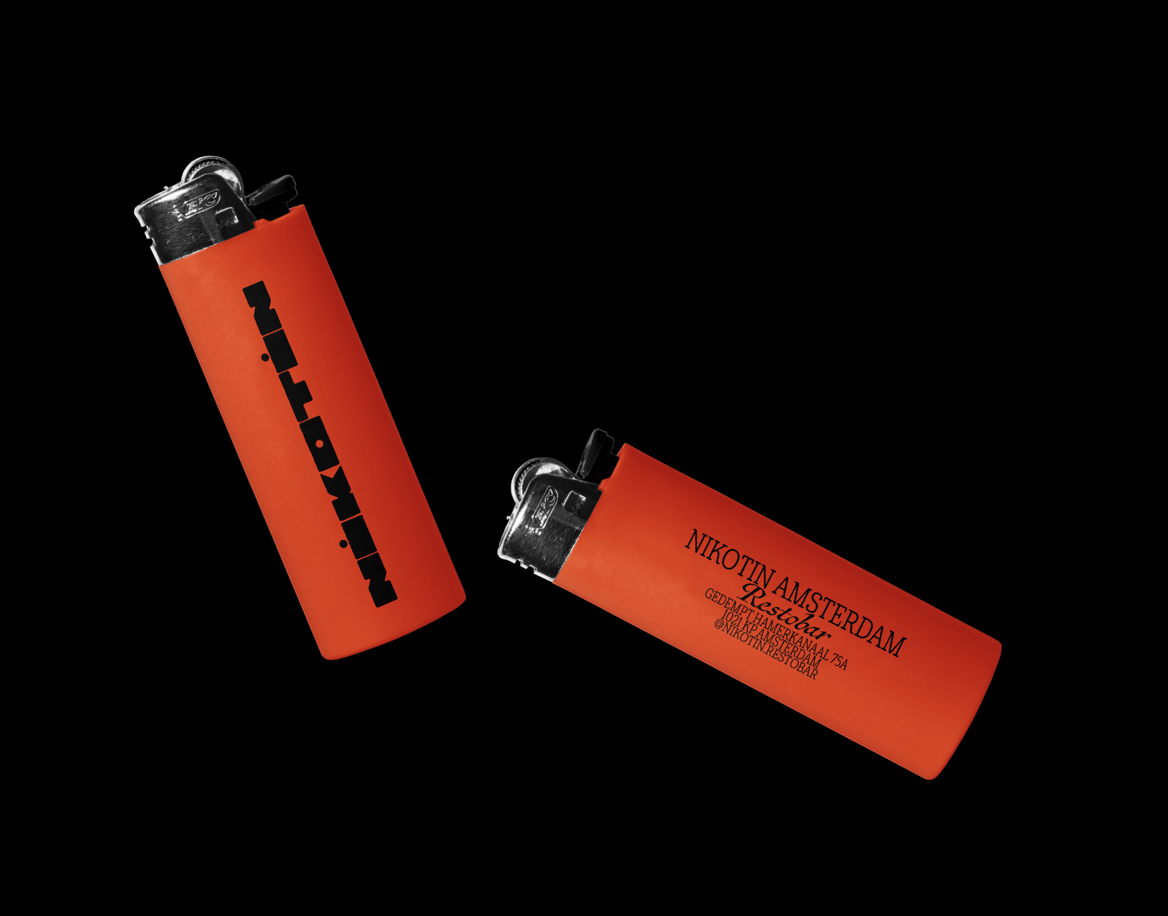 Two orange lighters with black text on a black background in a studio product shot. The lighters are positioned at an angle.
