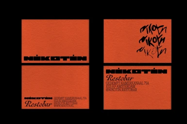 Nikotin restobar brand identity featuring business cards with orange textured paper and black typography against a dark background