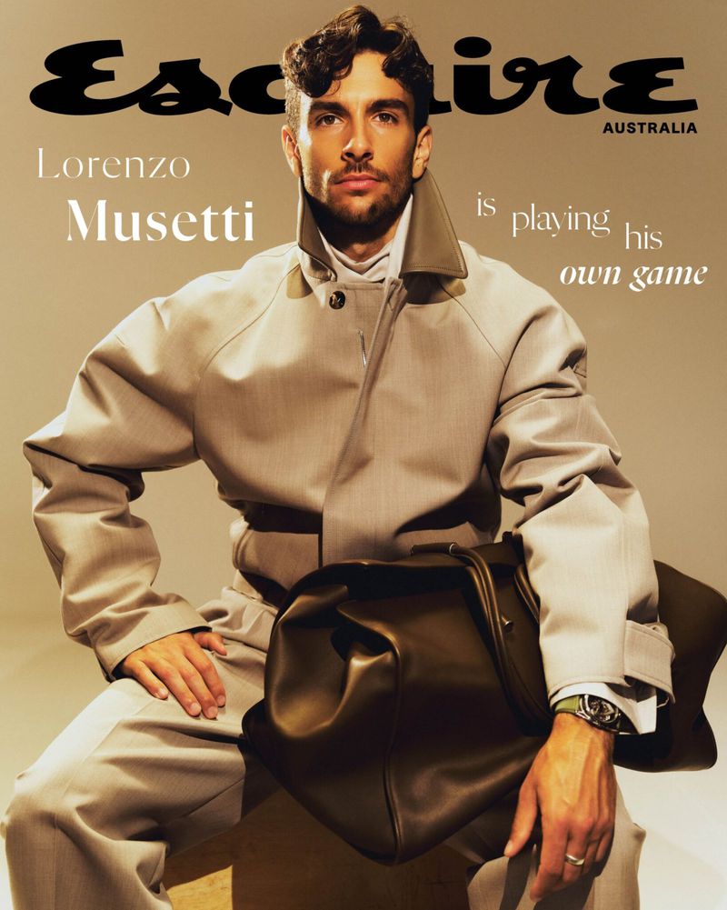 Esquire Australia cover featuring Lorenzo Musetti in beige suit holding a dark brown leather bag, sitting against a neutral background.
