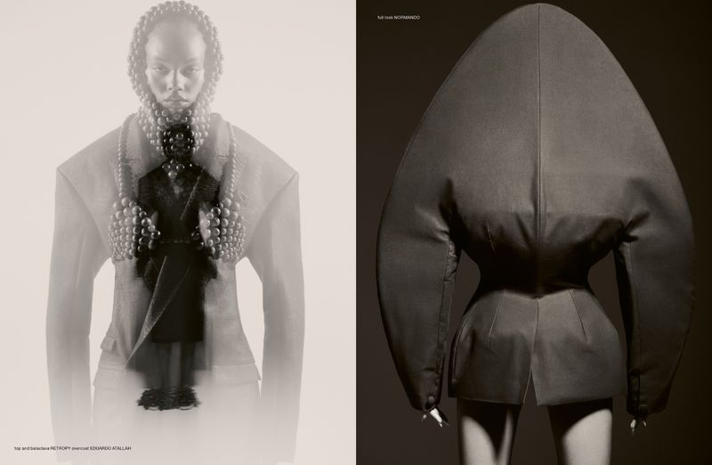 Monochromatic fashion editorial featuring an adult female model wearing a beaded hood and avant-garde blazer, showcasing unique couture.