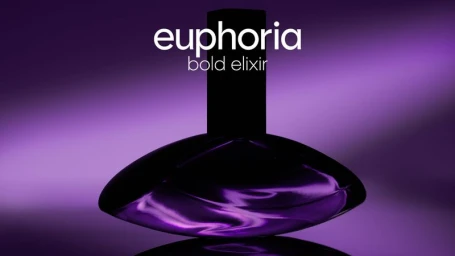 Dark purple perfume bottle positioned against a smooth purple gradient background with white text reading euphoria bold elixir