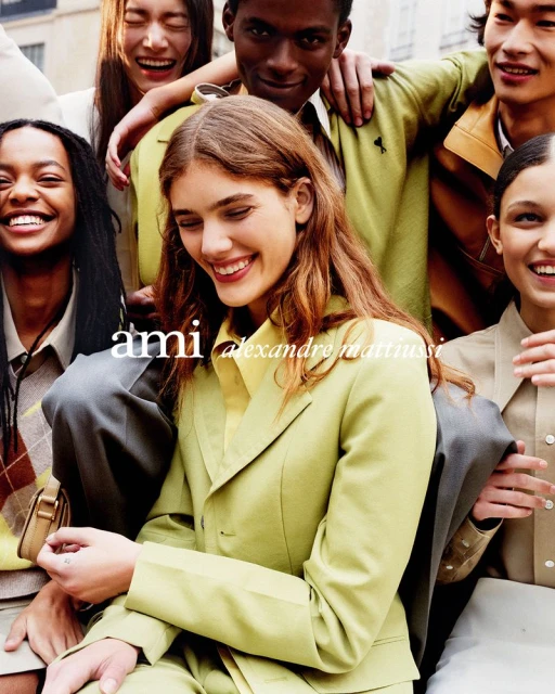 Group of smiling young adults wearing fashionable colourful clothing outdoors, posing for an outdoor portrait, fashion photography.