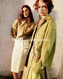 Two female models posing against a textured wall for the Ami S/S 2026 campaign photographed by Anthony Seklaoui
