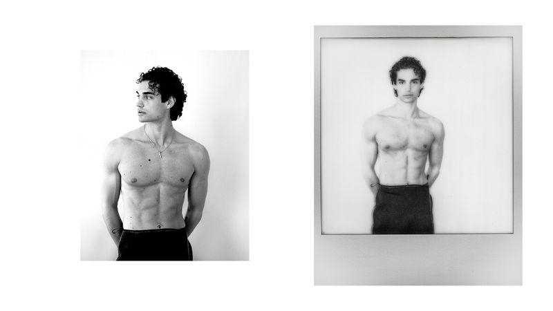 Black and white studio portrait of a shirtless adult male with curly hair, standing indoors, with a matching framed image to the right.