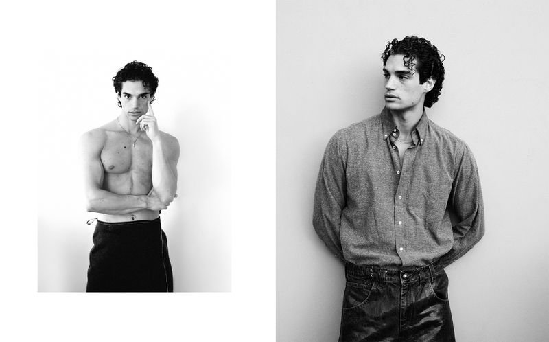 Black and white portrait of a shirtless male model with dark curly hair posing next to a photograph of a man in a shirt.