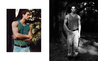 Man wearing a green crochet tank top and light wash jeans standing outdoors near trees.