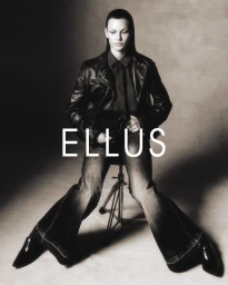 Model Bela Carfer in a black leather jacket and wide jeans seated on a tripod stool for Ellus F/W 2025 Campaign