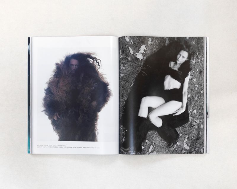 Open magazine spread features a person covered in brown fur standing on a white background, and a woman reclining on grass.