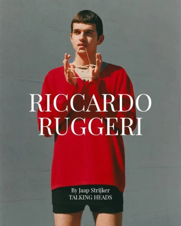 A young adult male poses in a red sweater against a grey wall, styled with rubber bands. Text reads 'Riccardo Ruggeri, By Jaap Strijker'.