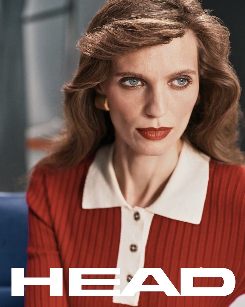Model with red lipstick wearing a red polo shirt with white collar for Head Golf Spring Summer 2026 campaign.