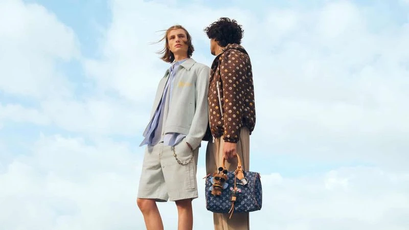 Two male models posing against a clear sky background for Louis Vuitton Spring 2026 Collection