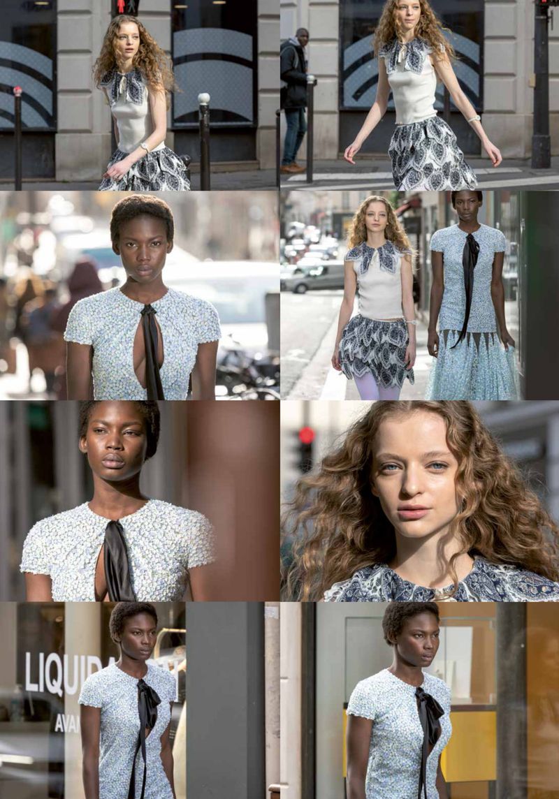 Fashion models showcase dresses with high necklines and ruffled skirts on an urban street during daytime, featuring pedestrians and vehicles.
