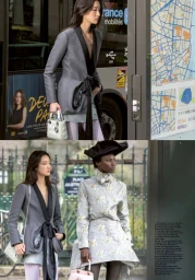 Two models posing outdoors in styled editorial clothing, holding small handbags near a bus and city structures.
