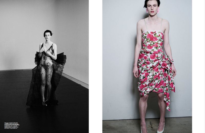Editorial fashion shot: A person in a black lace outfit poses next to a person in a floral dress against a grey backdrop.