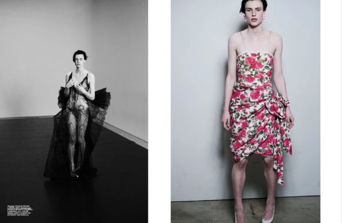 Editorial fashion shot: A person in a black lace outfit poses next to a person in a floral dress against a grey backdrop.