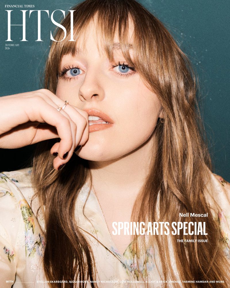 Close-up portrait of a young woman with light brown hair and blue eyes, wearing a floral top, featured on a magazine cover.