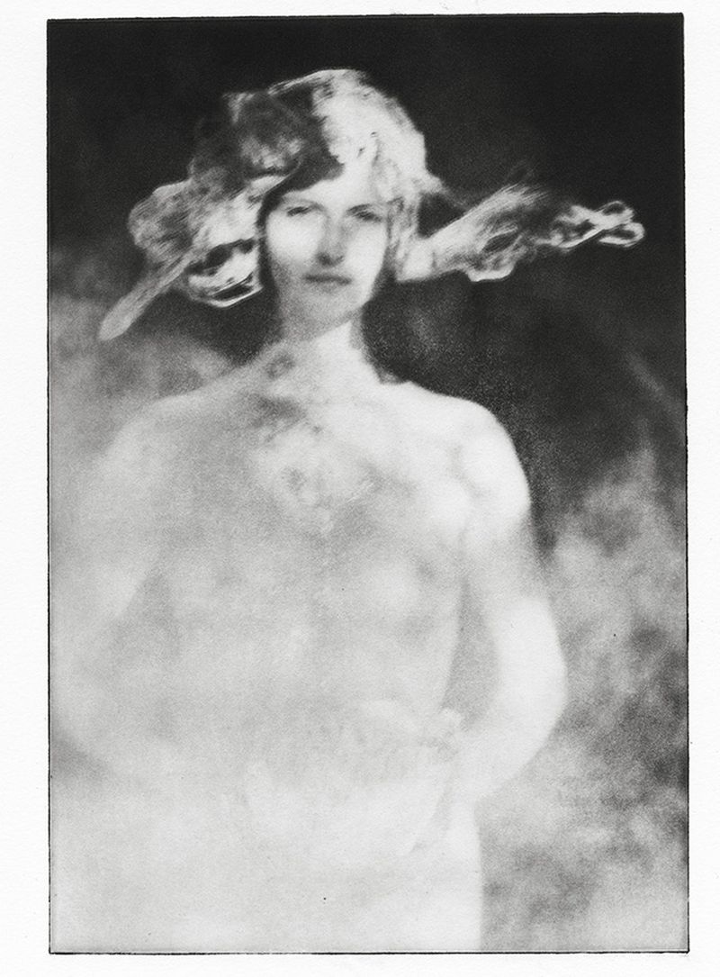 Artistic black and white portrait of an adult female with a decorative hat, captured with soft focus and diffused light, conveying a vintage feel.