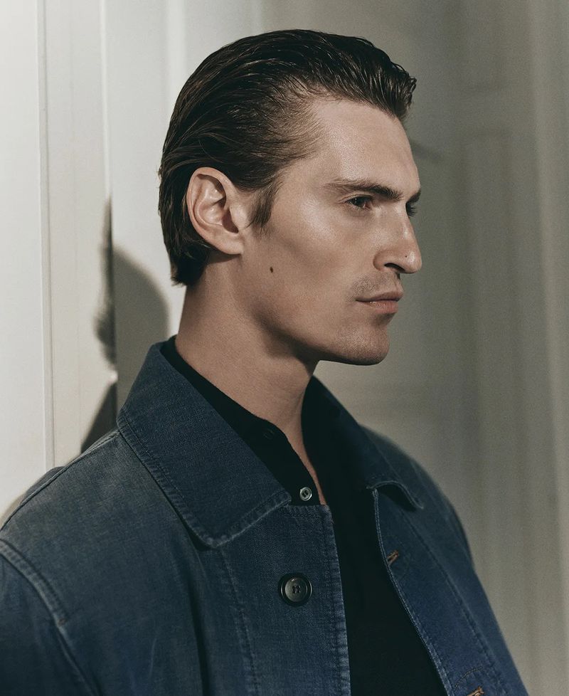 Close-up profile portrait of Myles Crosby wearing a blue denim jacket for Robb Report U.S.