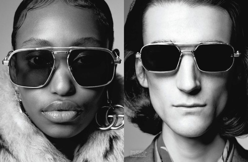 Close-up studio shot featuring two adults modeling black sunglasses with silver frames, the left side features a woman in a fur coat.