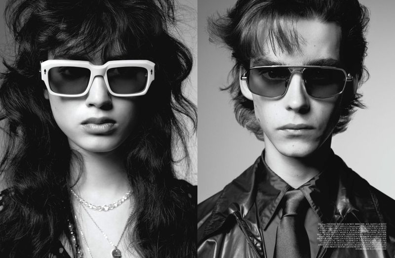Black and white portrait of a stylish woman with wavy hair and white sunglasses, and a man with tinted sunglasses and a leather jacket.