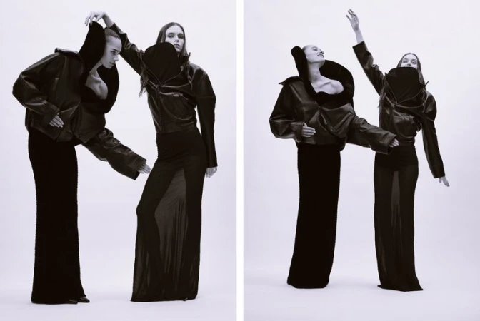 Two female models in black leather jackets and long skirts posing against a white background for Dazed Magazine