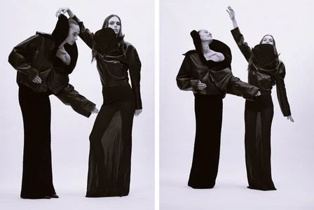 Two female models in black leather jackets and long skirts posing against a white background for Dazed Magazine