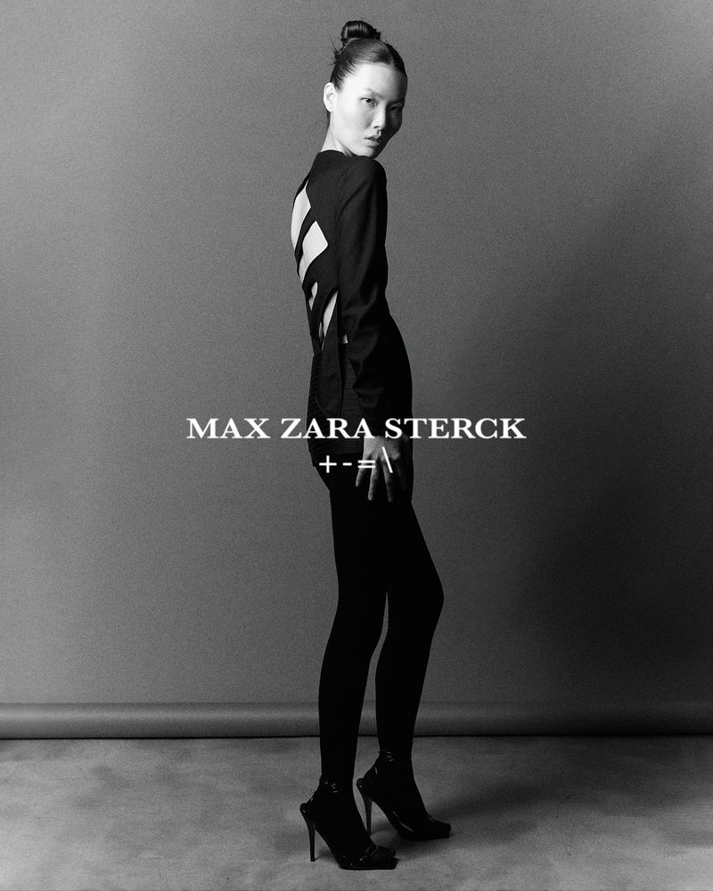 Fashion editorial shot in black and white featuring a woman in a black dress and heels against a gray backdrop, with text overlay.