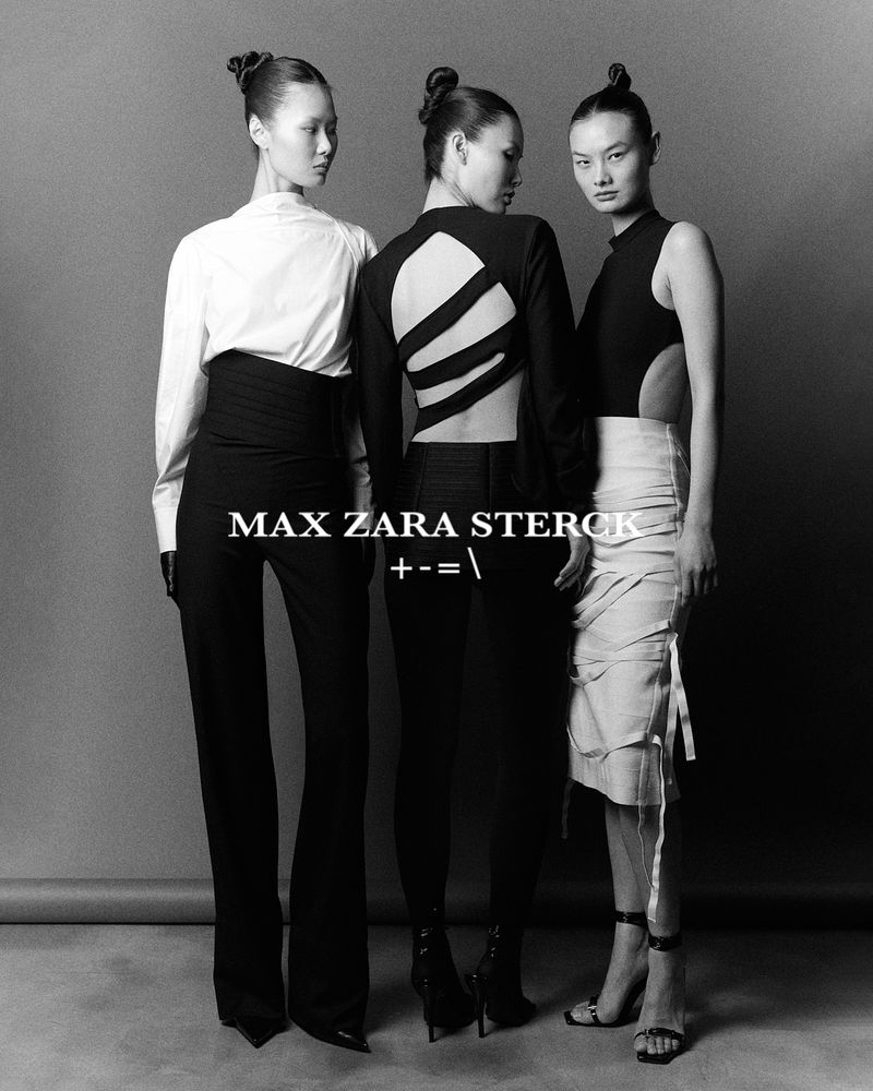 Black and white fashion shot of three adult women with updo hairstyles, wearing fashionable outfits in a neutral studio setting.
