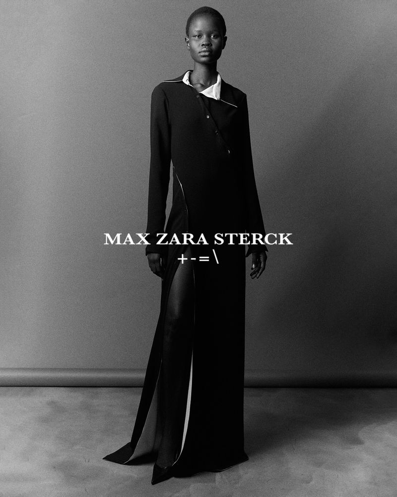 A stylish black-and-white portrait showcases a Black woman in a chic black dress with a thigh-high slit, posing in a neutral studio.
