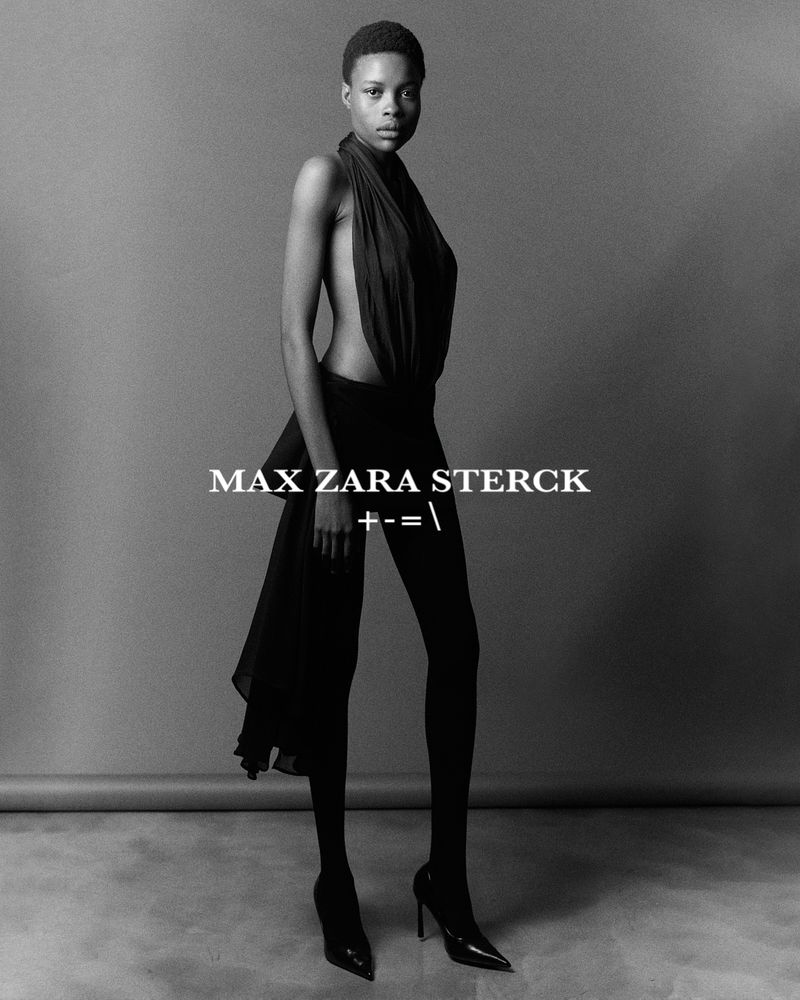 Black and white portrait of an adult female wearing a black top and high heels in a photo studio with the text MAX ZARA STERCK.