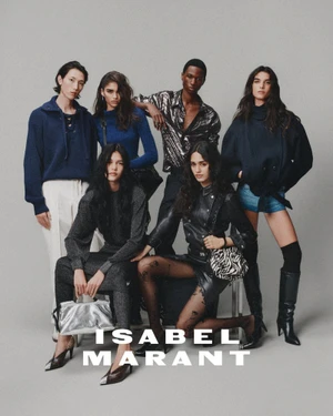Group of six fashion models posing together against a grey seamless background for Isabel Marant W26.