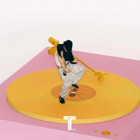 Person dances on a yellow turntable with a pink base against a white backdrop, creating a playful and dynamic visual for music-related content.