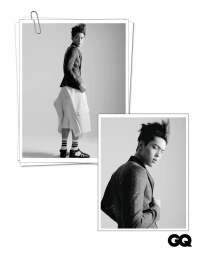 Monochrome fashion editorial featuring a man in a blazer and skirt against a seamless white studio background