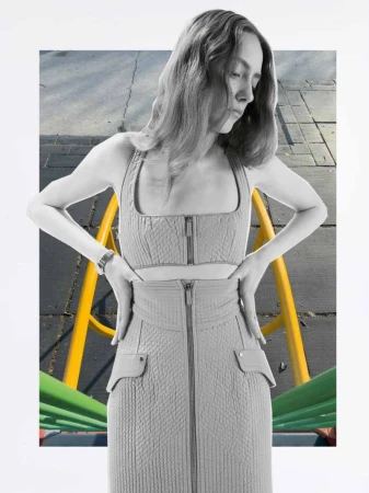 Woman in gray crop top and skirt, hands on hips, stands against a playground backdrop in a fashion editorial collage.