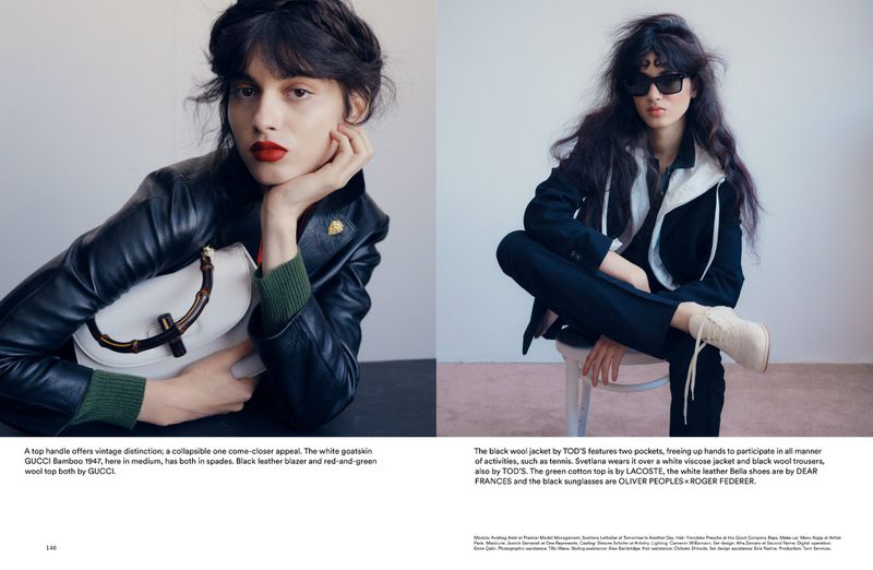Editorial fashion shot of two adult women wearing designer clothing and accessories in a photo studio setting with soft lighting.